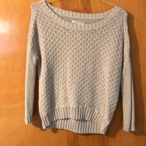 Light beige sweater, longer in back